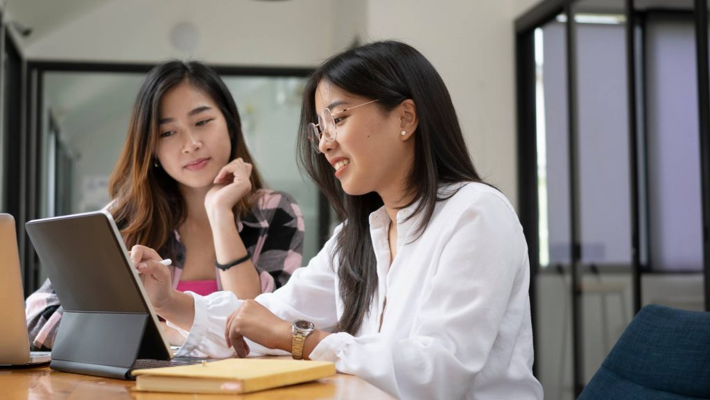 Two women working on a labtop
